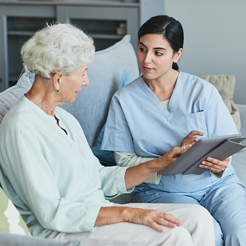 Nurse speaking with hospice patient